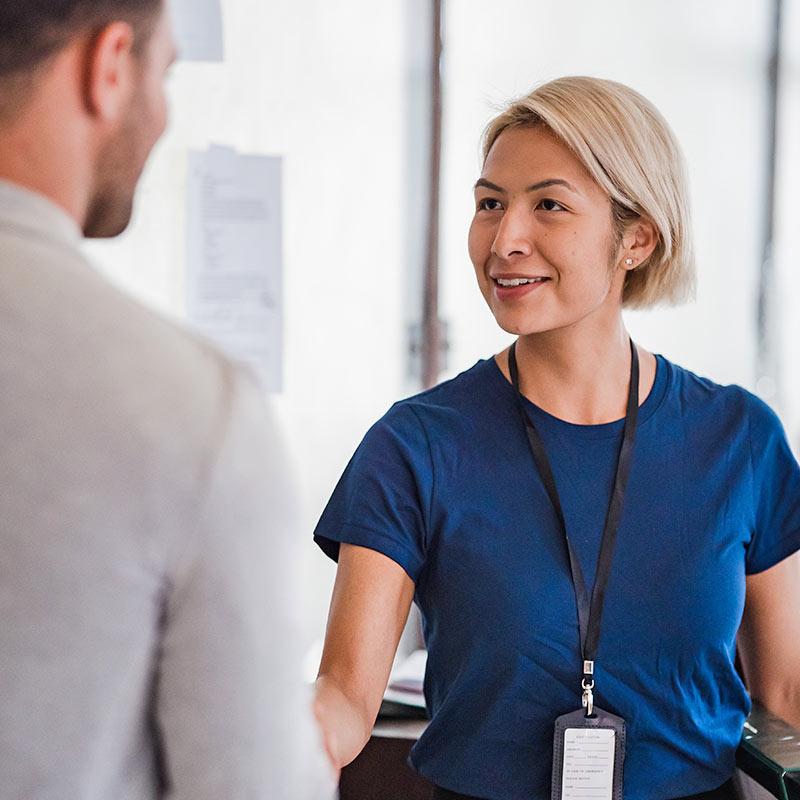 Healthcare professional reviewing patient outcomes
